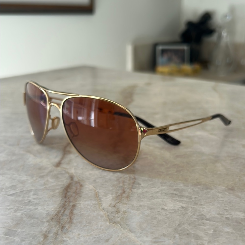 Gold OAKLEY Aviator Sunglasses with Brown Lenses